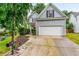 Charming two-story home with a two-car garage, an American flag, and a well-manicured front yard at 2865 Winter Rose Ct, Dunwoody, GA 30360