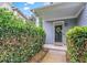 Charming covered front entryway framed by lush greenery offers a private and welcoming entrance at 2865 Winter Rose Ct, Dunwoody, GA 30360
