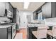 Modern kitchen features stainless steel appliances, granite countertops, tile backsplash and bar seating at 2865 Winter Rose Ct, Dunwoody, GA 30360