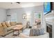 Inviting living room with modern furniture, a cozy fireplace, and bright natural light at 2865 Winter Rose Ct, Dunwoody, GA 30360