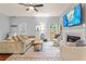 Inviting living room with modern furniture, a cozy fireplace, and bright natural light at 2865 Winter Rose Ct, Dunwoody, GA 30360