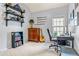 Well-lit home office featuring stylish decor, custom shelving, and large window for natural light at 2865 Winter Rose Ct, Dunwoody, GA 30360