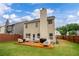 Well-maintained backyard featuring a wooden deck and privacy fence, perfect for relaxing and entertaining at 4015 Arch Pass, Cumming, GA 30040