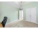 Bedroom features a large closet and an open door, providing a glimpse into the rest of the house at 4015 Arch Pass, Cumming, GA 30040