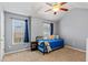 Bedroom with ceiling fan, window with blinds, and vaulted ceiling at 4015 Arch Pass, Cumming, GA 30040