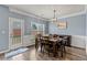 Elegant dining room with modern lighting, and access to outdoor space for easy entertaining and natural light at 4015 Arch Pass, Cumming, GA 30040