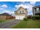 Inviting two-story home with a two-car garage, well-maintained lawn, and an ample driveway at 4015 Arch Pass, Cumming, GA 30040