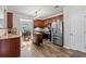 Modern kitchen with stainless steel appliances, granite countertops, a mobile island, and an adjacent dining area at 4015 Arch Pass, Cumming, GA 30040