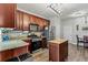 Open-concept kitchen with stainless steel appliances and granite countertops at 4015 Arch Pass, Cumming, GA 30040