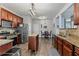 Spacious kitchen featuring granite countertops, stainless appliances, and a central island with a wooden countertop at 4015 Arch Pass, Cumming, GA 30040