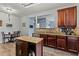 Charming kitchen featuring wooden cabinets, granite countertops, stainless steel appliances, and a breakfast nook at 4015 Arch Pass, Cumming, GA 30040