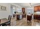 Stylish kitchen boasts granite countertops, stainless steel appliances, and a seamless transition to the dining area at 4015 Arch Pass, Cumming, GA 30040