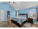 Bright main bedroom featuring high ceilings, wood-look floors, and lots of natural light at 4015 Arch Pass, Cumming, GA 30040