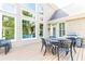 Backyard deck with an outdoor dining table and wooded view at 4090 Cooks Farm Nw Dr, Kennesaw, GA 30152