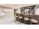 Basement bar area with bar stools, cabinetry, and shelving for storage at 4090 Cooks Farm Nw Dr, Kennesaw, GA 30152