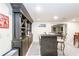 Finished basement bar area with dark cabinetry and wood paneled bar at 4090 Cooks Farm Nw Dr, Kennesaw, GA 30152