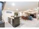 Open basement layout with a wet bar and a lounge area with a dining area at 4090 Cooks Farm Nw Dr, Kennesaw, GA 30152