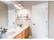 This bathroom features double sinks, a vanity with granite countertop and a white door at 4090 Cooks Farm Nw Dr, Kennesaw, GA 30152