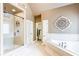 This bathroom features a glass enclosed shower and a soaking tub with decorative wall accents at 4090 Cooks Farm Nw Dr, Kennesaw, GA 30152