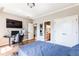 This bedroom offers natural light, hardwood floors, and access to an en-suite bathroom at 4090 Cooks Farm Nw Dr, Kennesaw, GA 30152