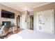 Cozy bedroom with a desk area, closet, decorated doors, and gray walls at 4090 Cooks Farm Nw Dr, Kennesaw, GA 30152
