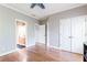 This bedroom features hardwood floors, a ceiling fan and access to an en-suite bathroom at 4090 Cooks Farm Nw Dr, Kennesaw, GA 30152