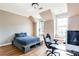 This bedroom features natural light, hardwood floors, a built-in window seat and a desk with gaming PC at 4090 Cooks Farm Nw Dr, Kennesaw, GA 30152