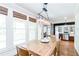 Inviting dining area with hardwood floors and multiple windows providing lots of natural light at 4090 Cooks Farm Nw Dr, Kennesaw, GA 30152