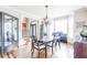 Elegant dining area with hardwood floors, chandelier, and plenty of natural light at 4090 Cooks Farm Nw Dr, Kennesaw, GA 30152