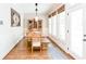 Bright dining room features hardwood floors, natural wood dining table and hutch, and plenty of natural light at 4090 Cooks Farm Nw Dr, Kennesaw, GA 30152