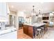 Expansive kitchen featuring a large island, granite countertops, stainless steel appliances, and hardwood floors at 4090 Cooks Farm Nw Dr, Kennesaw, GA 30152
