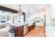 Open concept kitchen features large island with granite countertops, modern appliances, and hardwood floors at 4090 Cooks Farm Nw Dr, Kennesaw, GA 30152