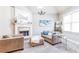 Cozy living room features a fireplace, plush seating, chandelier, and built-in shelving for storage at 4090 Cooks Farm Nw Dr, Kennesaw, GA 30152