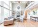 Bright living room with fireplace, built-ins, hardwood floors, and large windows for ample natural light at 4090 Cooks Farm Nw Dr, Kennesaw, GA 30152