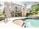 Backyard boasts a large pool, hot tub, an outdoor living space, and privacy at 4090 Cooks Farm Nw Dr, Kennesaw, GA 30152