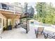 Backyard pool with a spiral staircase to an upper deck, lounge chairs, and stone waterfall at 4090 Cooks Farm Nw Dr, Kennesaw, GA 30152
