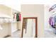 This walk-in closet features ample storage space, shelving and racks for organization at 4090 Cooks Farm Nw Dr, Kennesaw, GA 30152