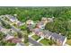 An aerial view of a two-story home nestled in a lush, green suburban community at 4125 Fallbrook Dr, Duluth, GA 30096