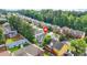 Aerial view of a single Gathering home in a community with mature trees and well-manicured lawns at 4125 Fallbrook Dr, Duluth, GA 30096