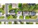 An aerial view of a single Gathering home with a traditional suburban landscape and driveway at 4125 Fallbrook Dr, Duluth, GA 30096