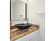 Modern half-bathroom with a vessel sink, granite countertop, and sleek fixtures at 4125 Fallbrook Dr, Duluth, GA 30096