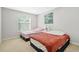 Bright bedroom with two twin beds, closet, and a nightstand with a decorative lamp at 4125 Fallbrook Dr, Duluth, GA 30096