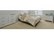 Cozy bedroom with carpet floors, white dresser, and natural light from the window at 4125 Fallbrook Dr, Duluth, GA 30096