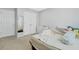 Comfortable bedroom with neutral carpet, double closets, and a window for natural light at 4125 Fallbrook Dr, Duluth, GA 30096