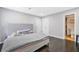 Bedroom with dark wood floors, an en suite bathroom, recessed lights, and neutral walls creating a serene atmosphere at 4125 Fallbrook Dr, Duluth, GA 30096