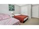 Inviting bedroom with two twin beds, closet, and a nightstand with a decorative lamp at 4125 Fallbrook Dr, Duluth, GA 30096