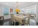 Elegant dining area featuring a table with seating and a view into a living area at 4125 Fallbrook Dr, Duluth, GA 30096