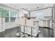 Well-lit kitchen features stainless appliances, granite counters, a breakfast bar and an adjacent window with natural light at 4125 Fallbrook Dr, Duluth, GA 30096