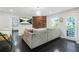 Well-lit living room featuring hardwood floors, comfortable seating, and access to the backyard through a glass door at 4125 Fallbrook Dr, Duluth, GA 30096