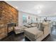 Comfortable living room featuring a stone accent wall with a fireplace, and a spacious seating area at 4125 Fallbrook Dr, Duluth, GA 30096
